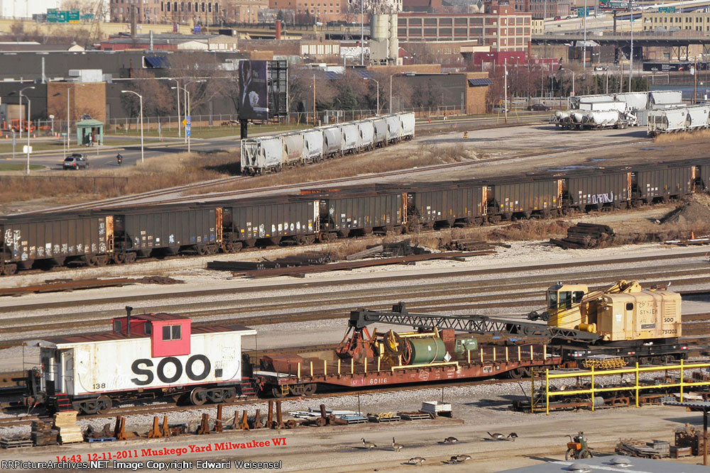 Milwaukee Road in whe middle of the Soo crane and caboose